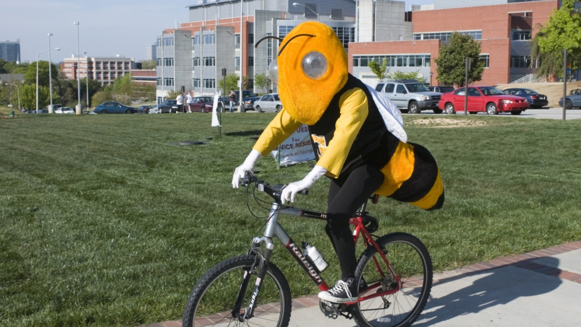 buzz the mascot riding bicycle